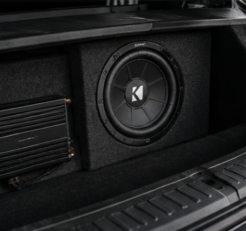 Kicker subwoofer and amplifier installed in a trunk